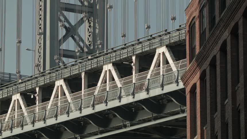 View of a large bridge as vehicles travel over it
