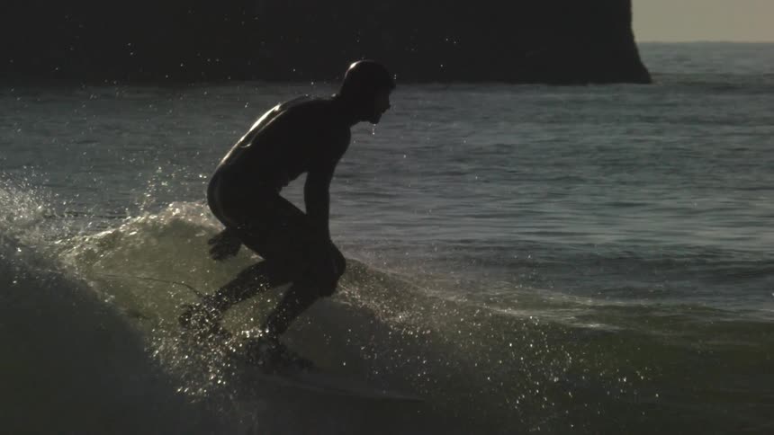 Man surfs the waves on a sunny day