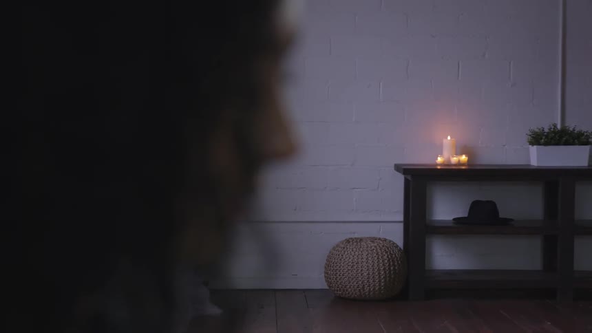 A young woman sits inside