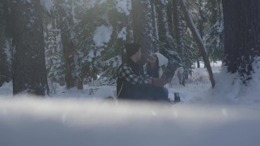 Couple camping on a forest at winter