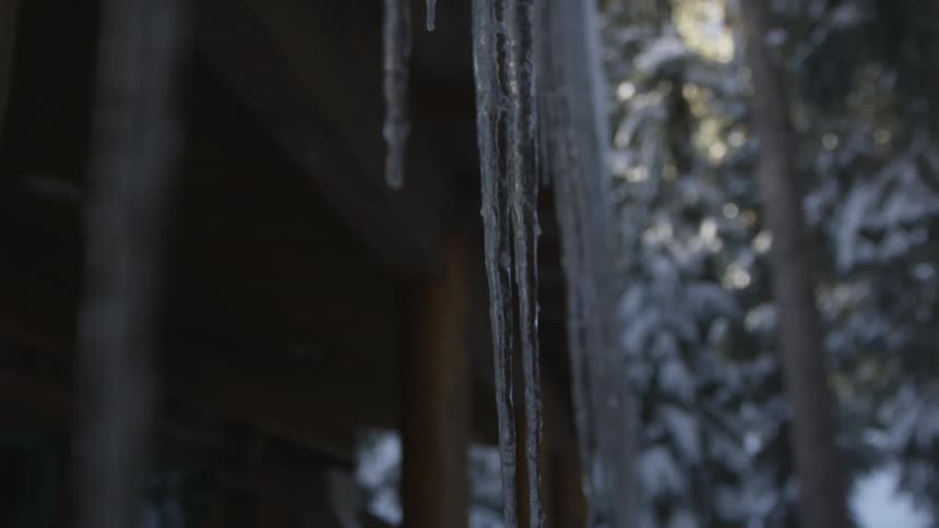 Icicles hang from a cabins eaves