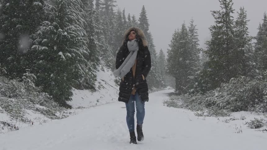 A woman walking in the snow
