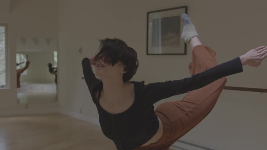 A woman is dancing in the dance hall