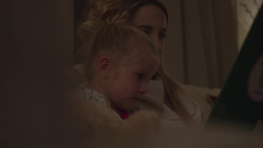 Mother reading a story to her daughter
