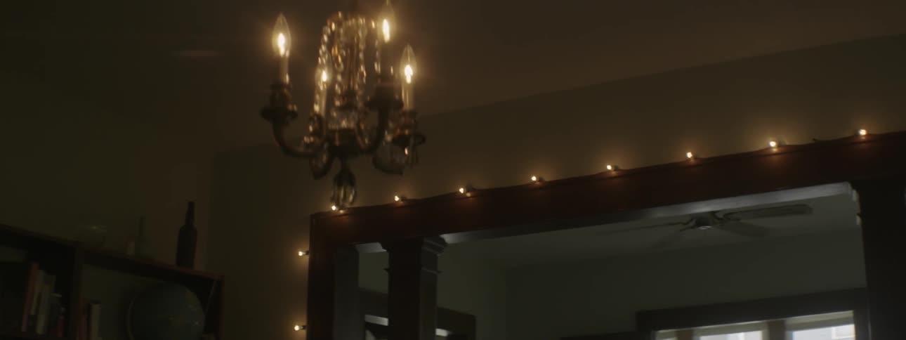 An ornate chandelier illuminates a room