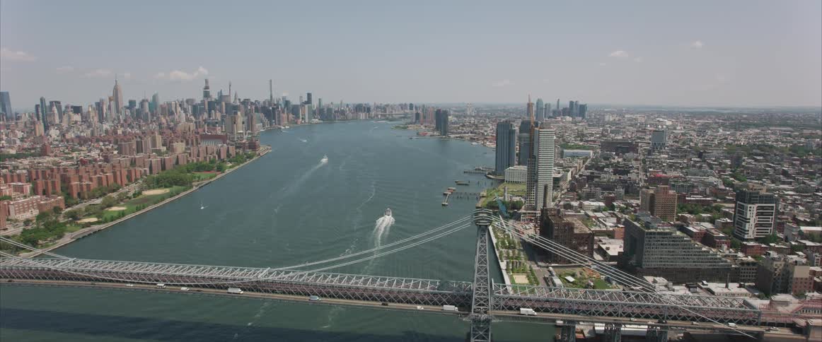 An aerial shot of a city on the river
