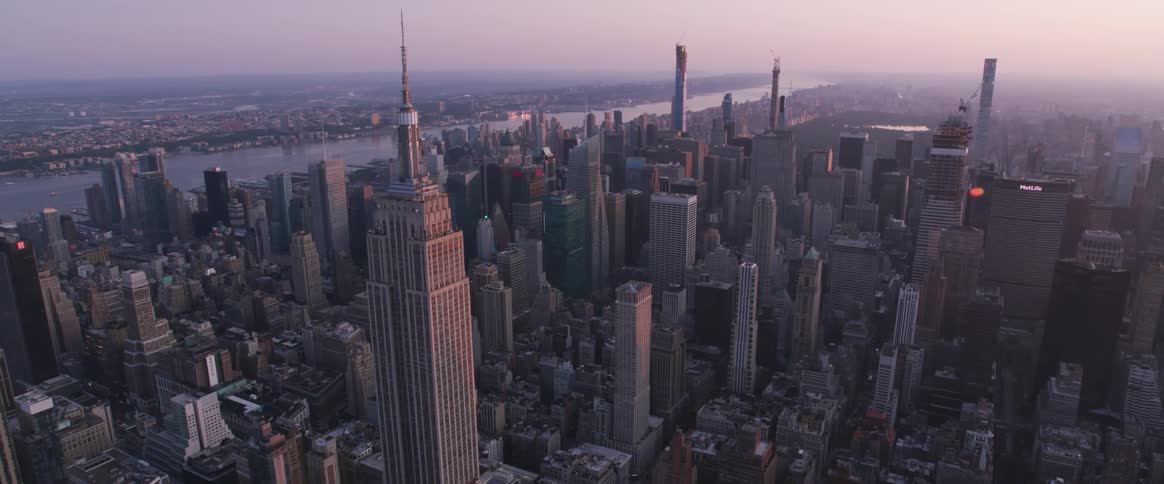 A dense metropolis from above at sunset