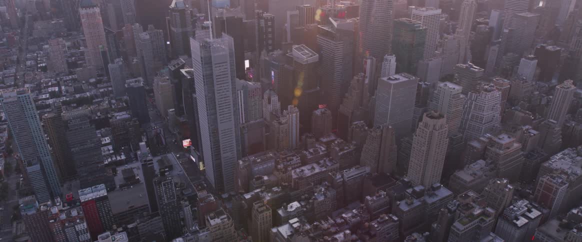 The camera looks down on a metro city