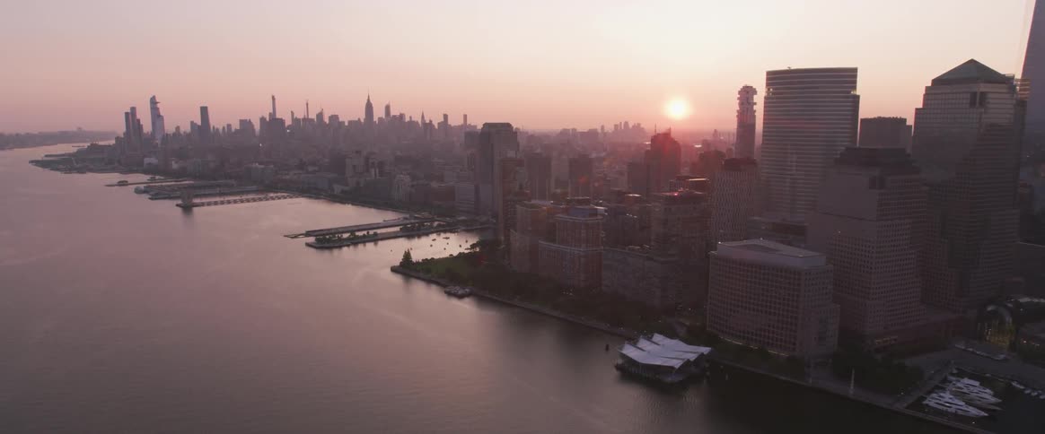 Sun sets behind downtown skyscrapers