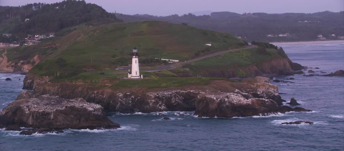A lighthouse located on the edge of a cliff