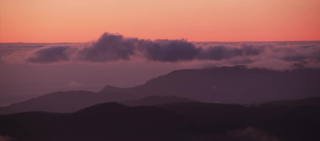 Red sky behind hills