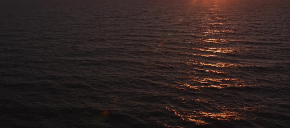 The glow of the sun over the water