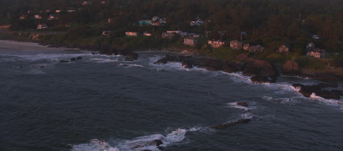 Waves crashing into rocks along the shore