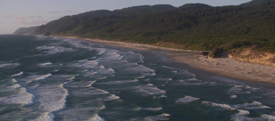 A hilly coastline during the day