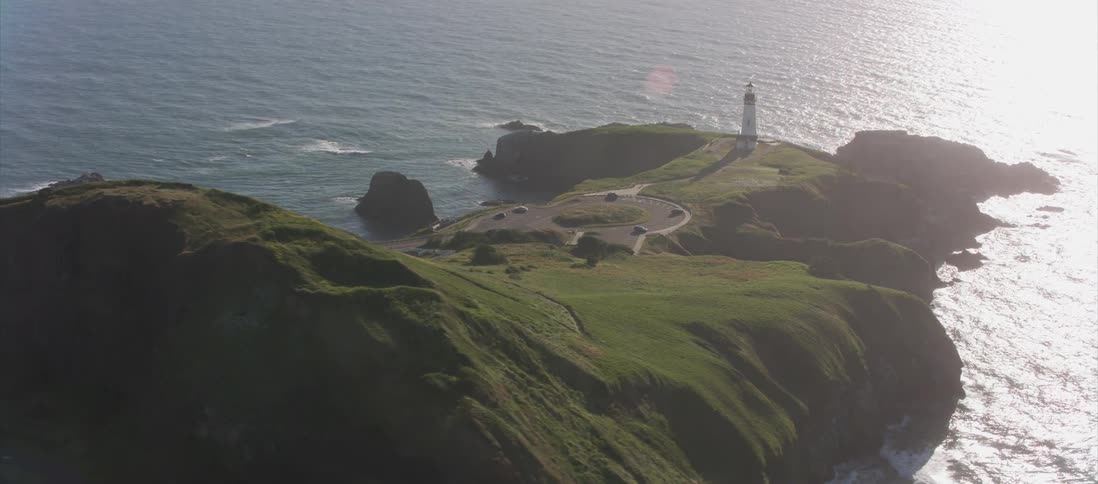 Aerial view of a lighthouse on the cliffs of a coast
