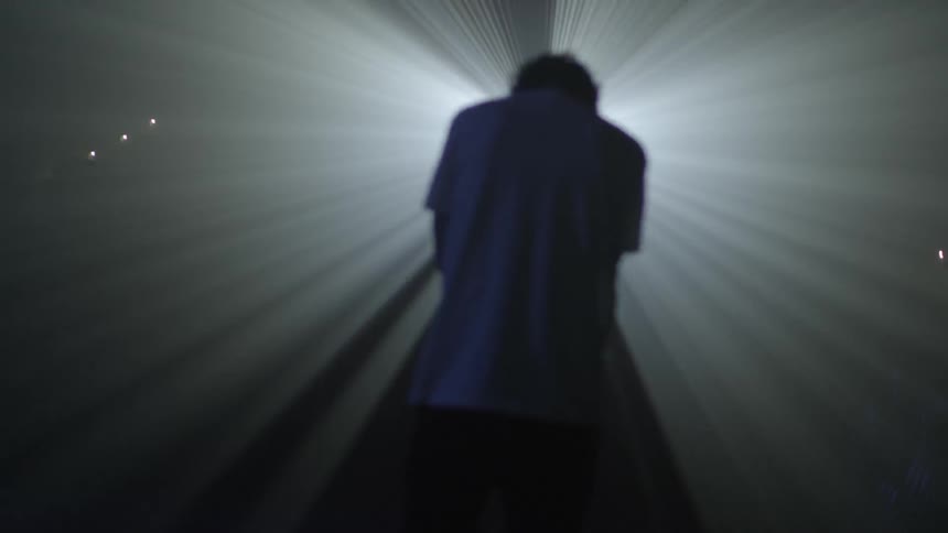 A man has a bright light in his face
