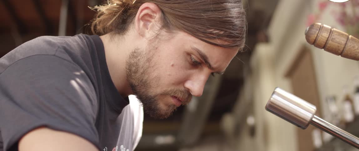 A man concentrates while he works