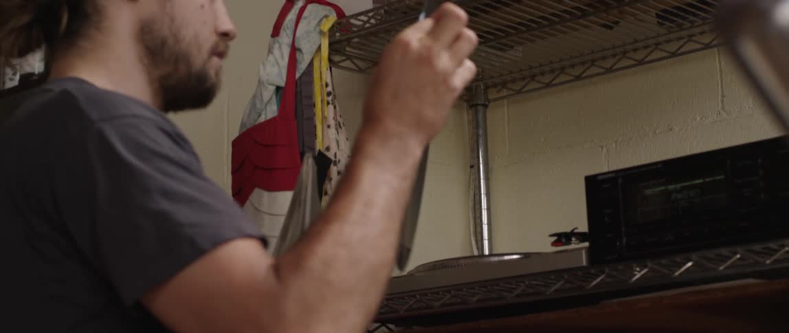 Man pulls out a record and plays it