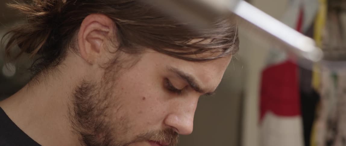 A man looks at something in his hands