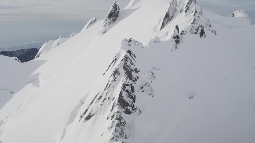 A mountain is covered in snow