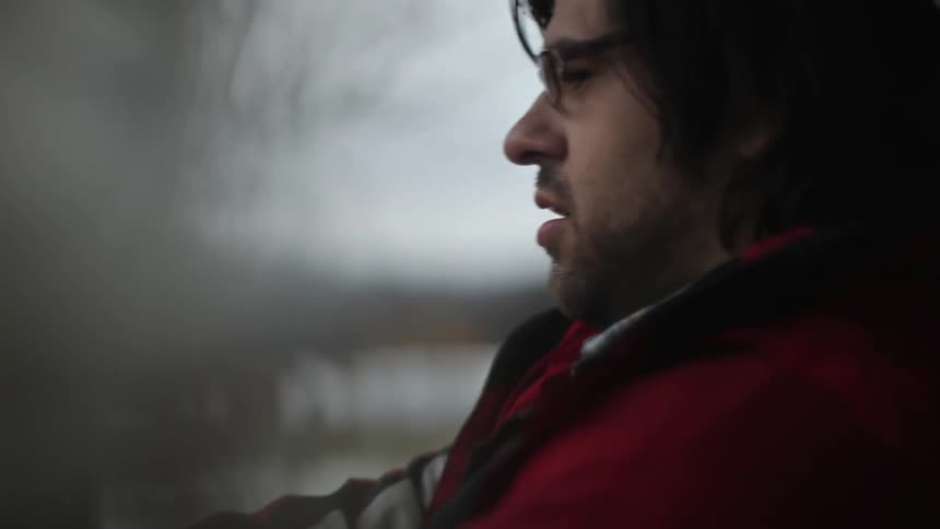 A person sitting b a window