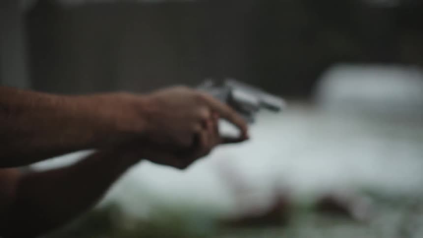 A person holding a gun