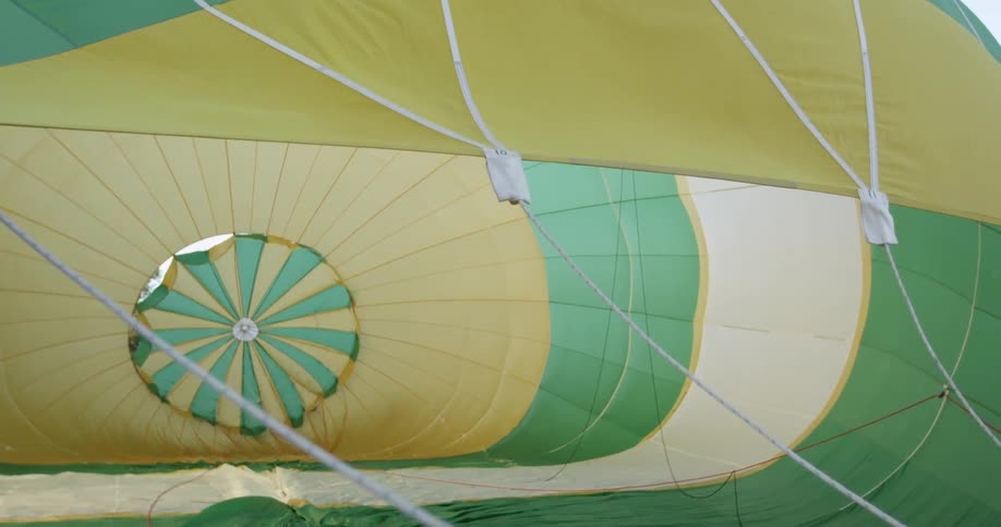 Strings are attached to a billowing fabric