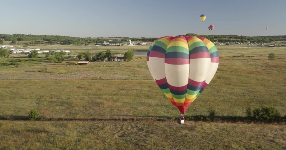 A hot air balloon landing on the ground