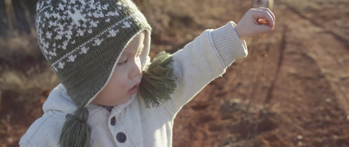 A kid in a wooly hat