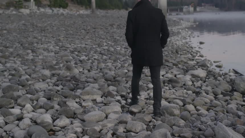 A person walking on rocks