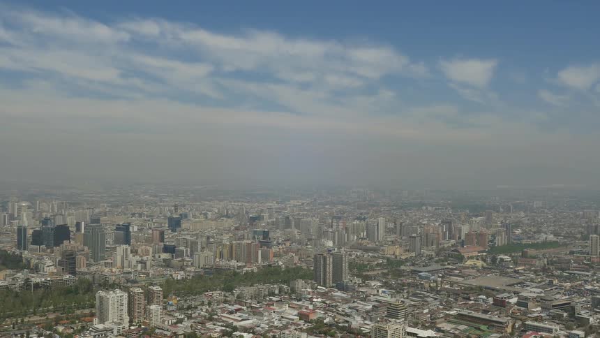Clouds float over a cityscape