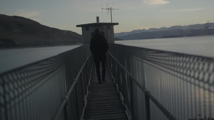 A person walking down a pier