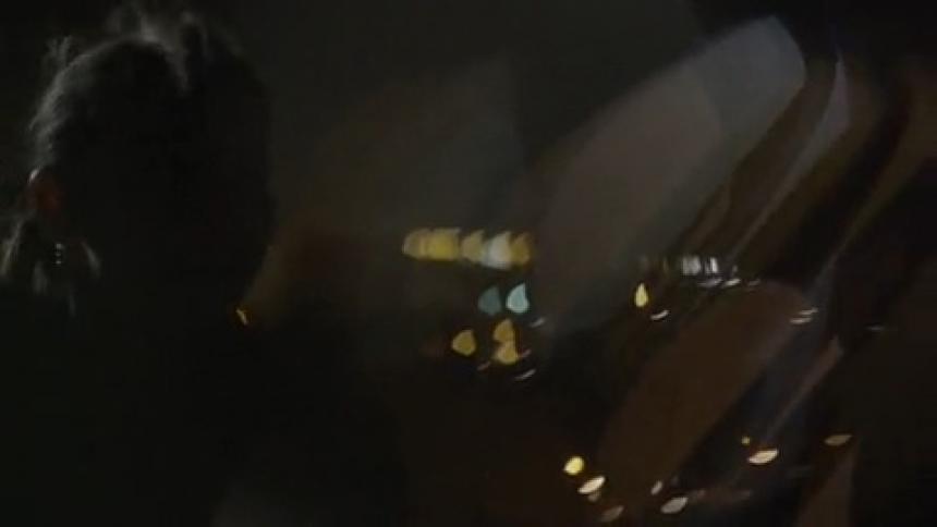 Woman standing outside in the dark