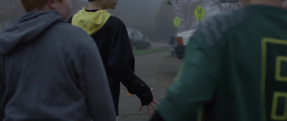 A group of boys toss a football around