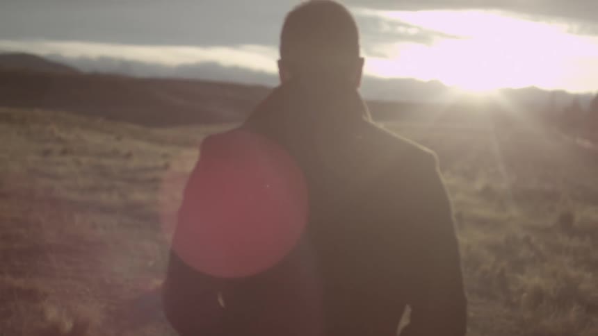 A man walking during sunset