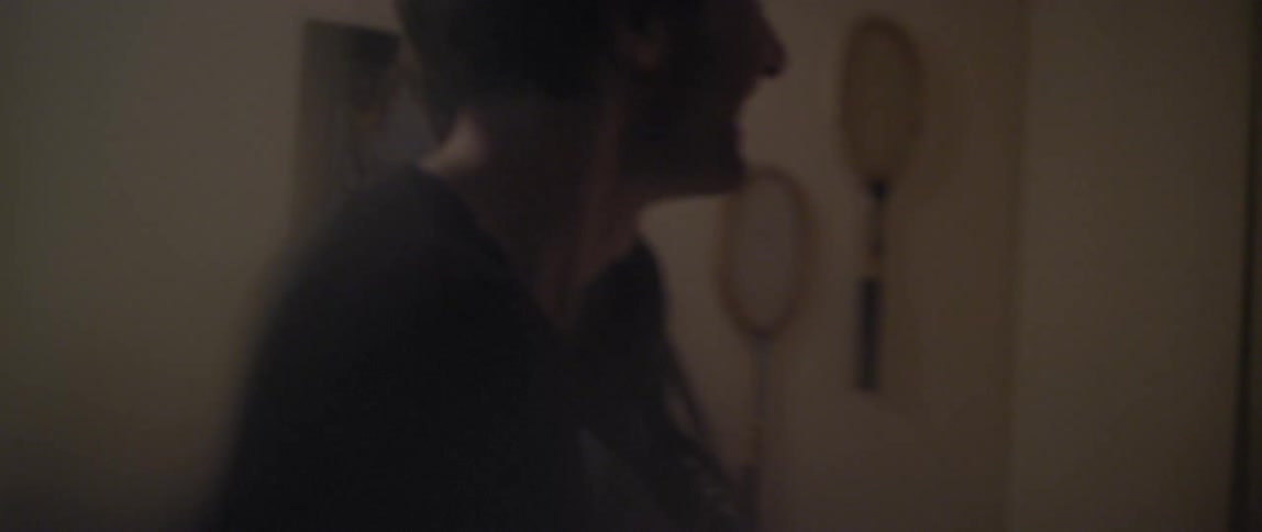 A man and woman dance and laugh