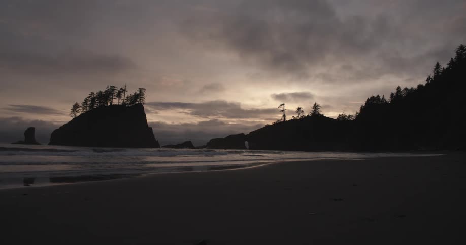 The sun sets on a quiet cove