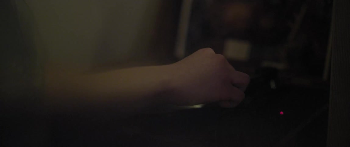 A person plays a record
