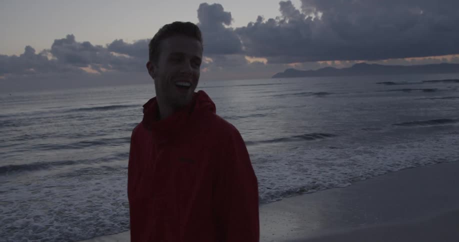 A man walking along the beach