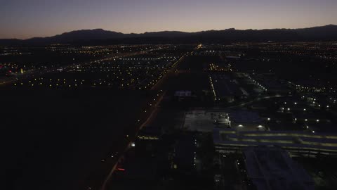 A city is shown from above at night