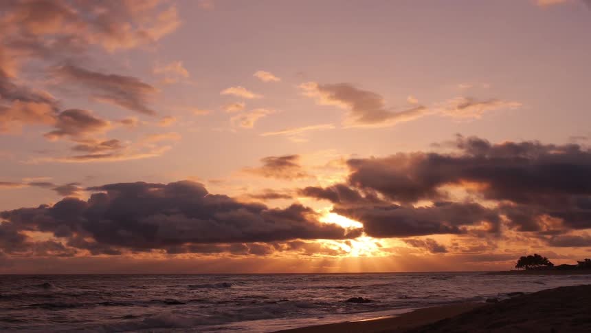 The sun sets over the ocean