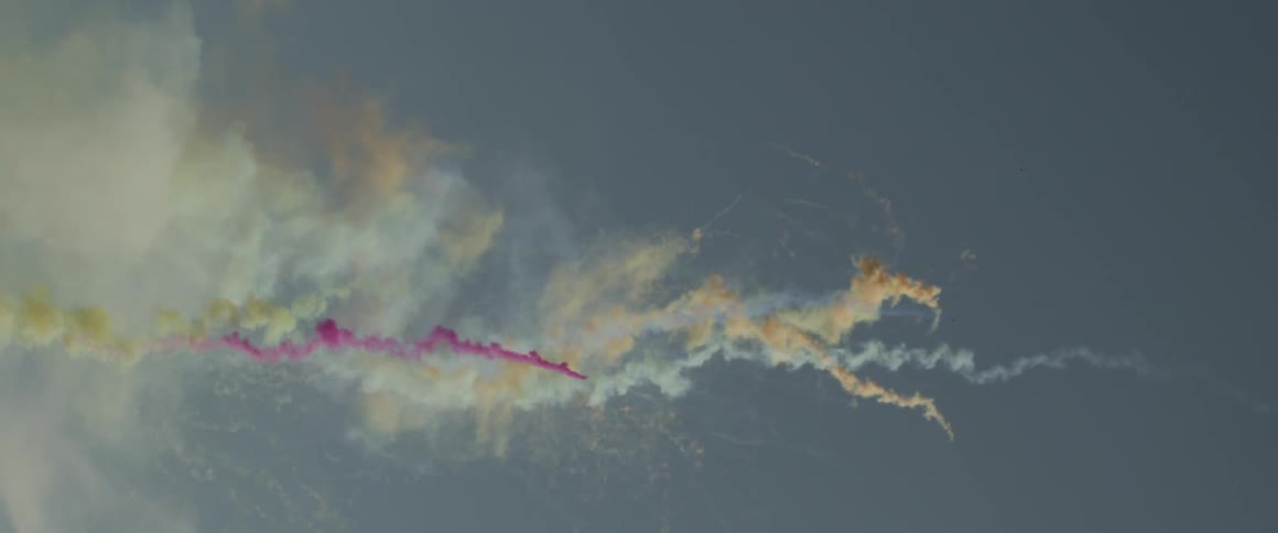 The sky displaying various colored smokes