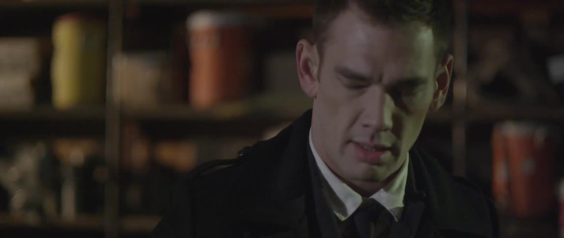 A man adjusts his coat in slow motion