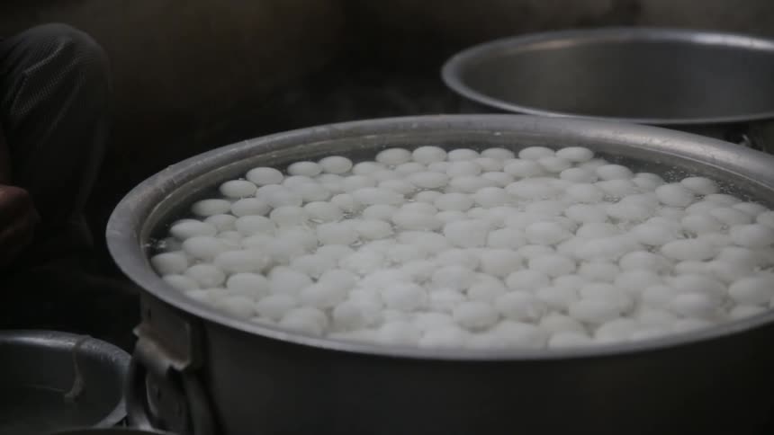 A large portion of eggs being boiled