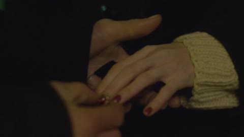 A person proposing with a ring