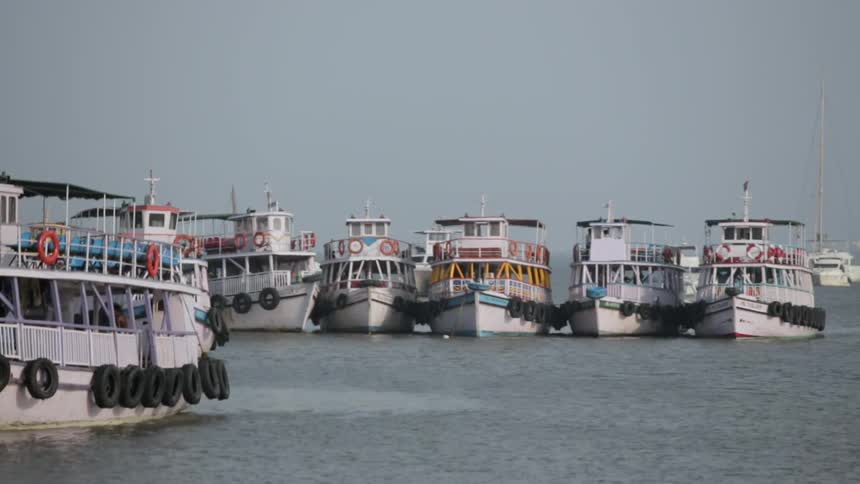 Tugboats float on the ocean