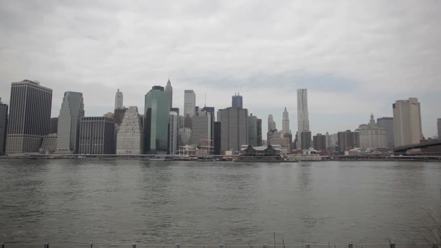 A city is seen from across a bay