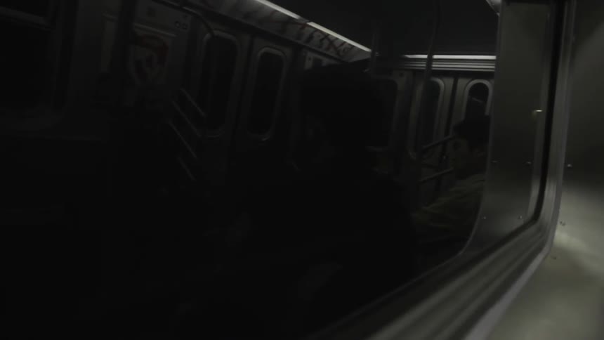 A subway passes an empty subway car