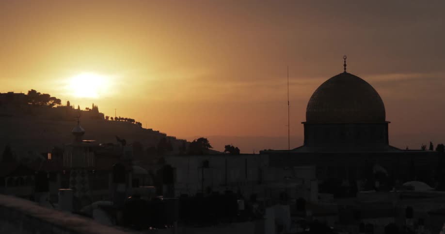 A gold domed building at dusk