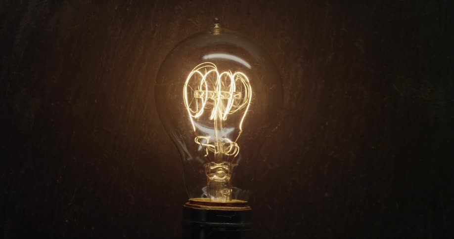A transparent, lit light bulb